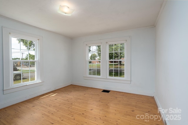 357 N Main St, Mount Pleasant, NC 28124 - unfurnished room featuring plenty of natural light, light wood finished floors, and ornamental molding