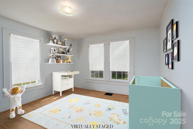 357 N Main St, Mount Pleasant, NC 28124 - playroom with wood finished floors and ornamental molding