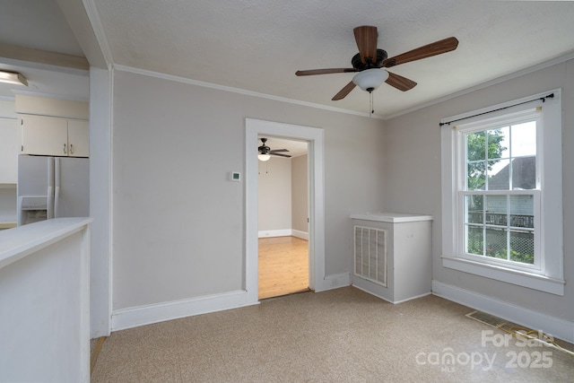 357 N Main St, Mount Pleasant, NC 28124 - empty room featuring ceiling fan and crown molding
