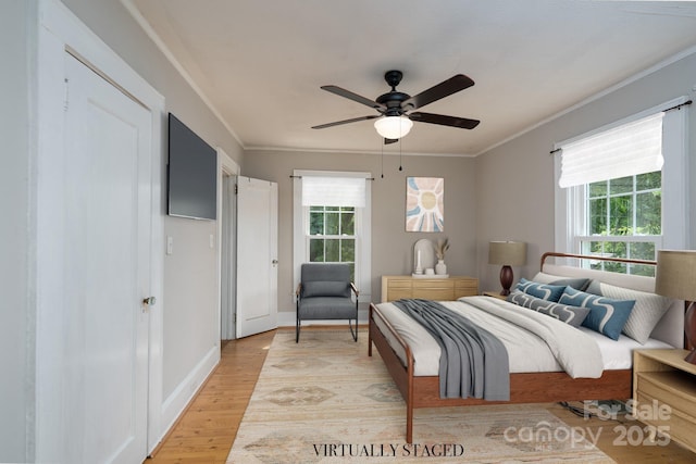 357 N Main St, Mount Pleasant, NC 28124 - bedroom with multiple windows, light wood finished floors, ornamental molding, and a ceiling fan