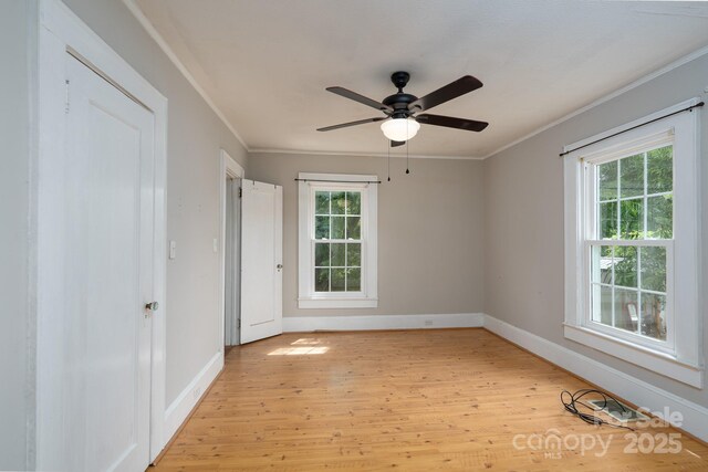 357 N Main St, Mount Pleasant, NC 28124 - empty room featuring light wood-type flooring, ornamental molding, and ceiling fan