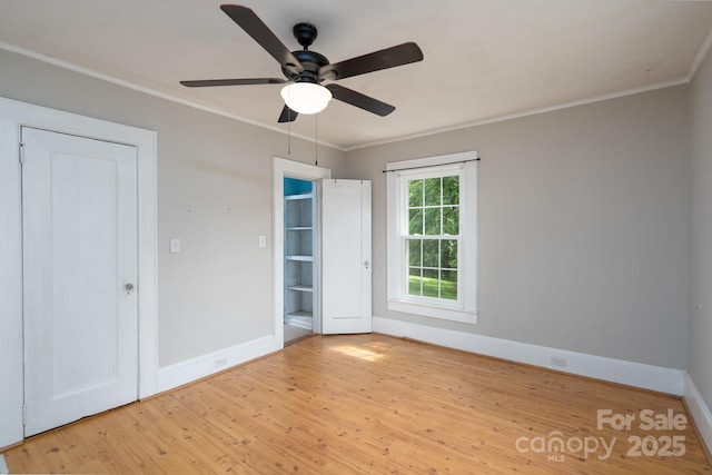 357 N Main St, Mount Pleasant, NC 28124 - empty room featuring light wood-type flooring, ornamental molding, and ceiling fan