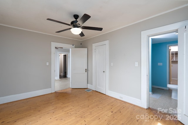 357 N Main St, Mount Pleasant, NC 28124 - unfurnished bedroom featuring wood finished floors, ornamental molding, a closet, and ceiling fan