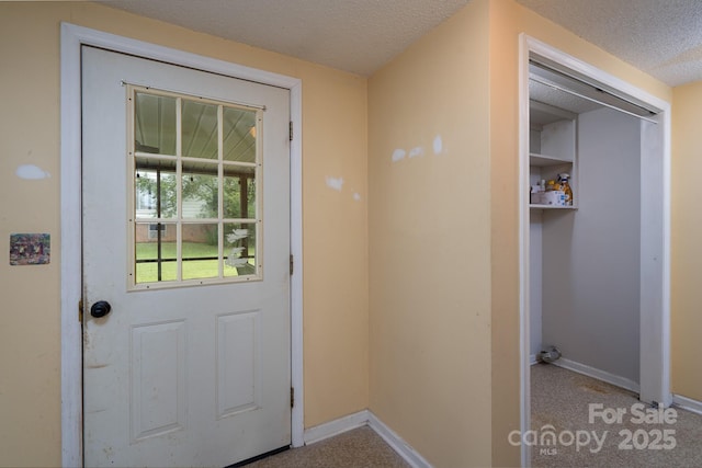 357 N Main St, Mount Pleasant, NC 28124 - doorway to outside featuring a textured ceiling and carpet
