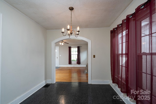 357 N Main St, Mount Pleasant, NC 28124 - foyer featuring arched walkways, a textured ceiling, a chandelier, crown molding, and granite floors