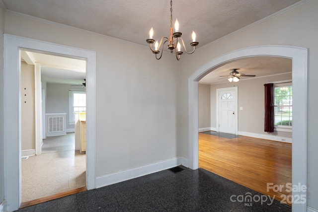 357 N Main St, Mount Pleasant, NC 28124 - unfurnished room featuring arched walkways, a ceiling fan, plenty of natural light, ornamental molding, and a textured ceiling