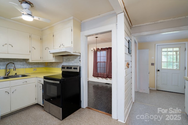 357 N Main St, Mount Pleasant, NC 28124 - kitchen with stainless steel electric stove, under cabinet range hood, backsplash, light countertops, and a ceiling fan