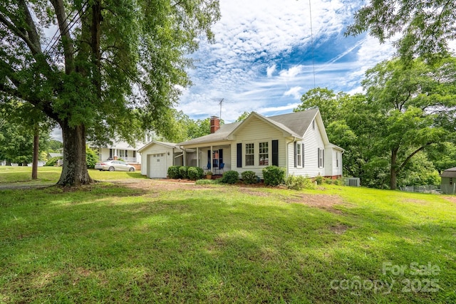 357 N Main St, Mount Pleasant, NC 28124 - ranch-style house featuring a chimney, a garage, a front yard, and a porch