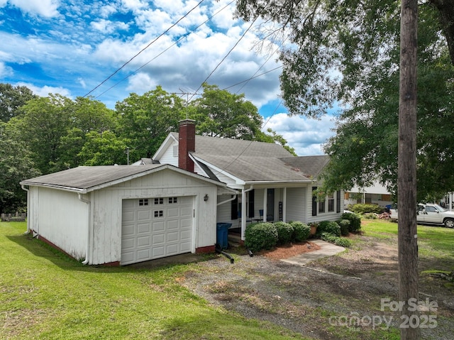 357 N Main St, Mount Pleasant, NC 28124 - single story home with dirt driveway, a chimney, a front yard, an attached garage, and covered porch