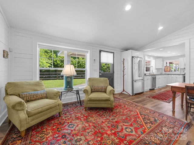 2784 Pea Ridge Rd, Mill Spring, NC 28756 - living room featuring lofted ceiling, wood finished floors, and wood walls