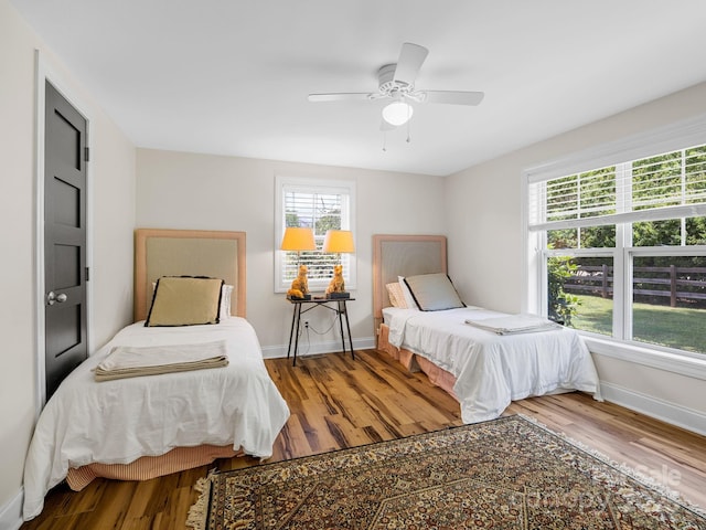 2784 Pea Ridge Rd, Mill Spring, NC 28756 - bedroom featuring wood finished floors and ceiling fan