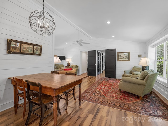 2784 Pea Ridge Rd, Mill Spring, NC 28756 - dining room with wood finished floors, wood walls, a chandelier, a ceiling fan, and recessed lighting