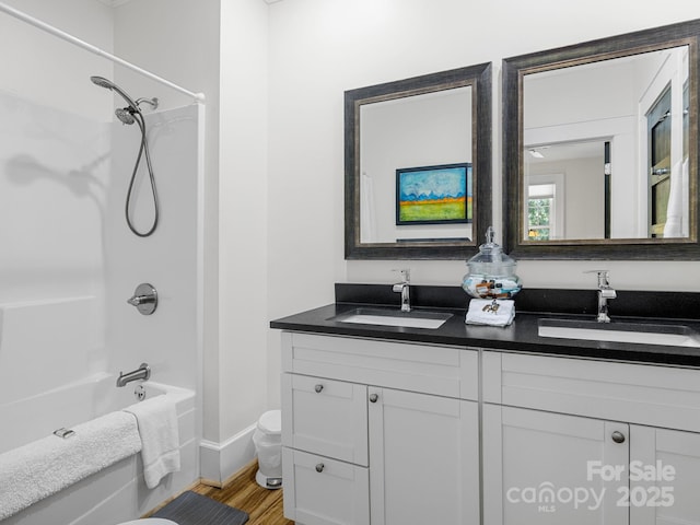 2784 Pea Ridge Rd, Mill Spring, NC 28756 - full bath featuring double vanity, wood finished floors, and bathing tub / shower combination