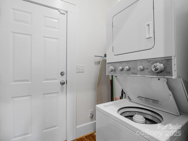 2784 Pea Ridge Rd, Mill Spring, NC 28756 - laundry room with stacked washer and clothes dryer and wood finished floors