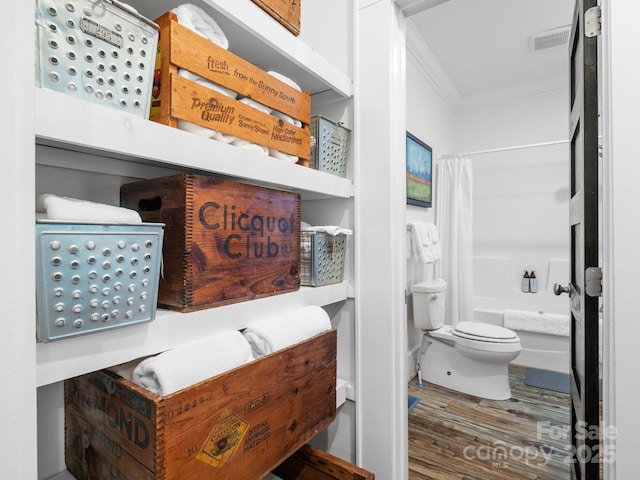 2784 Pea Ridge Rd, Mill Spring, NC 28756 - full bath with ornamental molding, wood finished floors, and shower / bathtub combination with curtain
