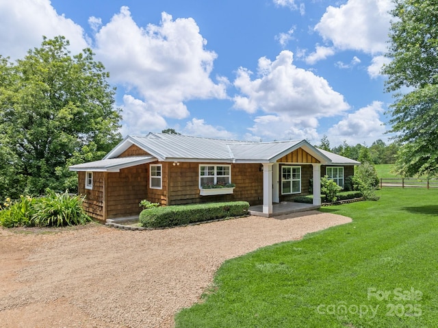 2784 Pea Ridge Rd, Mill Spring, NC 28756 - ranch-style home with driveway and a metal roof