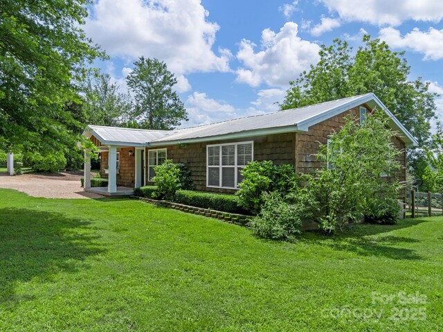 2784 Pea Ridge Rd, Mill Spring, NC 28756 - ranch-style home with a metal roof and covered porch