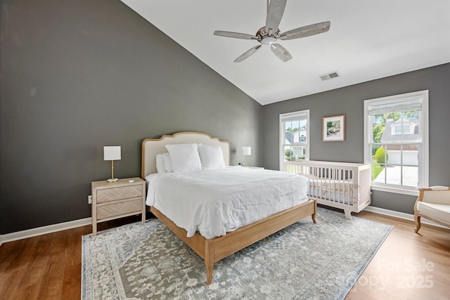 5005 Chestnut Knoll Ln, Charlotte, NC 28269 - bedroom featuring wood finished floors, lofted ceiling, and a ceiling fan