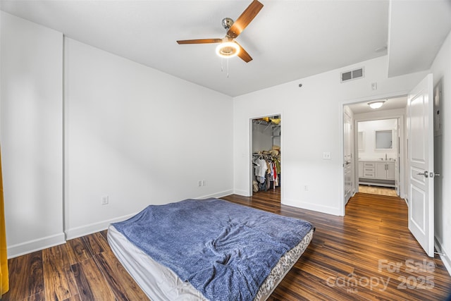 1315 E Blvd Unit 321, Charlotte, NC 28203 - bedroom with wood finished floors, a ceiling fan, and a closet