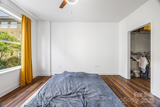1315 E Blvd Unit 321, Charlotte, NC 28203 - bedroom with multiple windows, wood finished floors, and a spacious closet