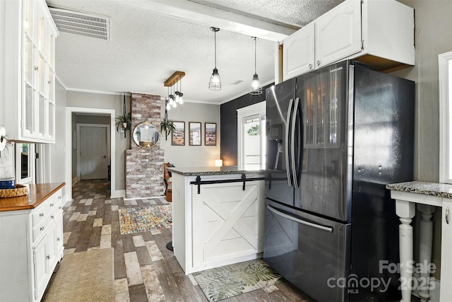 840 10th Street Blvd NW, Hickory, NC 28601 - kitchen with fridge with ice dispenser, white cabinets, a textured ceiling, ornamental molding, and pendant lighting
