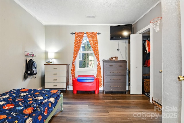840 10th Street Blvd NW, Hickory, NC 28601 - bedroom with a textured ceiling, wood finished floors, and crown molding