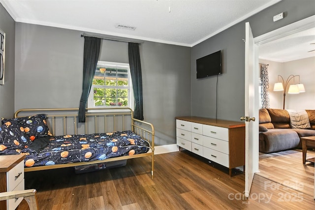 840 10th Street Blvd NW, Hickory, NC 28601 - bedroom featuring wood finished floors and ornamental molding