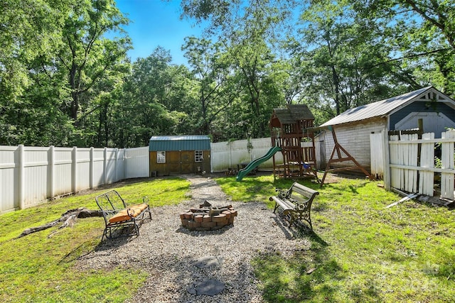 840 10th Street Blvd NW, Hickory, NC 28601 - fenced backyard with a storage shed, an outdoor fire pit, and a playground