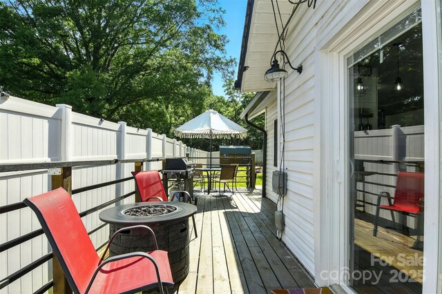 840 10th Street Blvd NW, Hickory, NC 28601 - deck with a fire pit and outdoor dining area