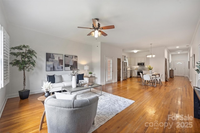 3519 Card St, Charlotte, NC 28205 - living room featuring ceiling fan and light wood-type flooring