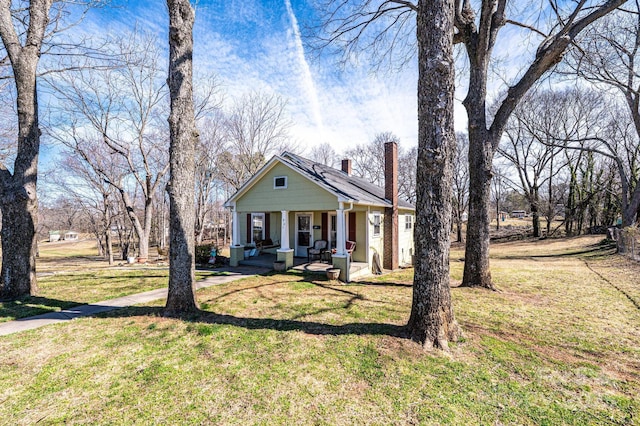 905 Orchard St SW, Valdese, NC 28690 - view of front of home with a chimney, covered porch, and a front yard