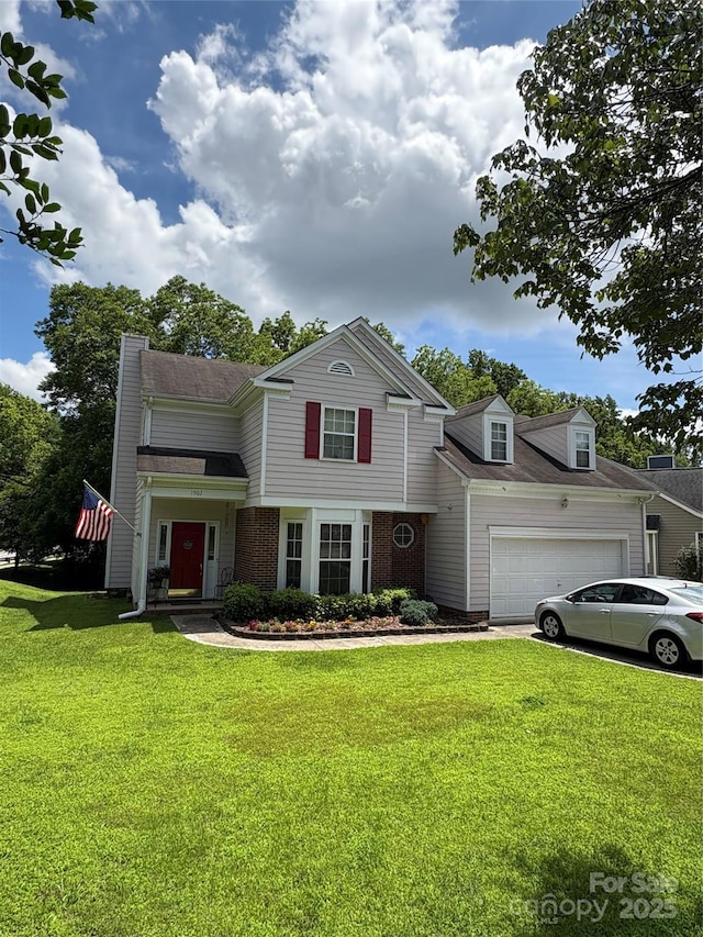 1902 Stonewyck Ave, Kannapolis, NC 28081 - traditional home featuring an attached garage, a front lawn, a chimney, brick siding, and driveway