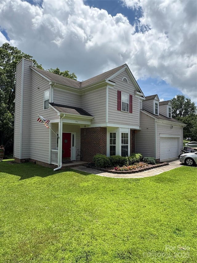 1902 Stonewyck Ave, Kannapolis, NC 28081 - view of front of home with an attached garage, a front lawn, and a chimney