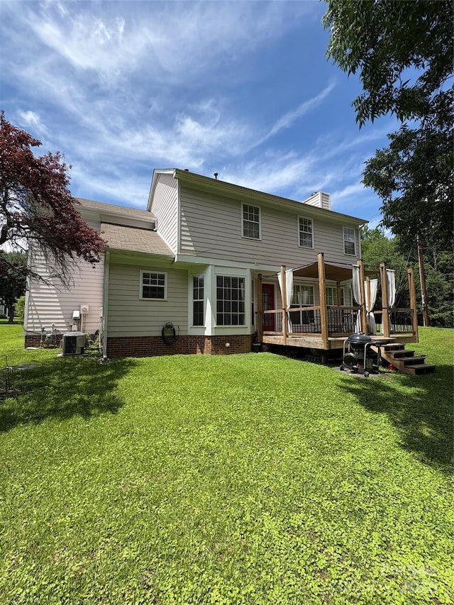 1902 Stonewyck Ave, Kannapolis, NC 28081 - rear view of house featuring a yard, a wooden deck, and a chimney