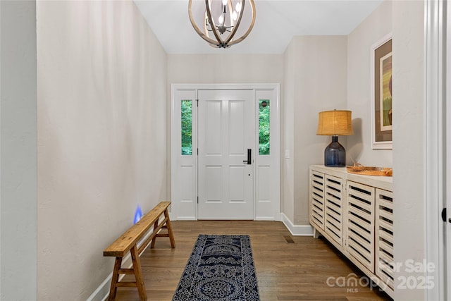 877 Winding Creek Rd, Sapphire, NC 28774 - entrance foyer with wood finished floors and a chandelier
