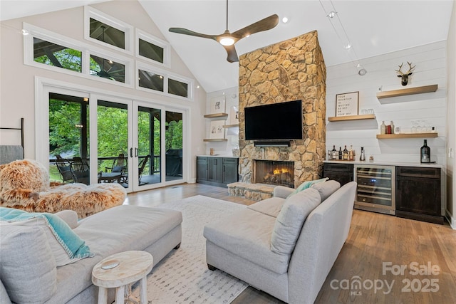 877 Winding Creek Rd, Sapphire, NC 28774 - living room featuring wine cooler, light wood-type flooring, a dry bar, high vaulted ceiling, and a ceiling fan