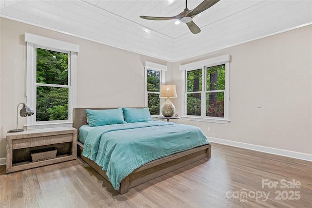 877 Winding Creek Rd, Sapphire, NC 28774 - bedroom with wooden ceiling, multiple windows, wood finished floors, crown molding, and ceiling fan