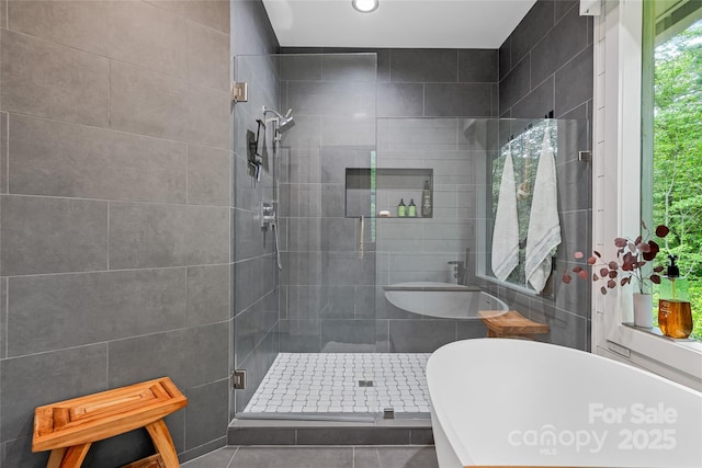 877 Winding Creek Rd, Sapphire, NC 28774 - bathroom featuring a shower stall, a freestanding tub, and recessed lighting
