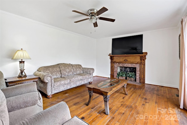 233 Church St, Ellenboro, NC 28040 - living room featuring ceiling fan, hardwood / wood-style flooring, ornamental molding, and a fireplace