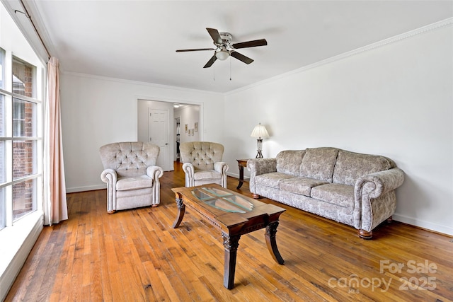 233 Church St, Ellenboro, NC 28040 - living room with a ceiling fan, crown molding, and light wood-type flooring