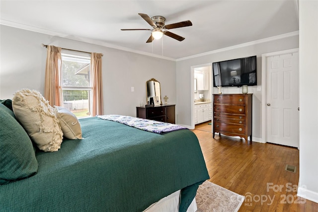 233 Church St, Ellenboro, NC 28040 - bedroom with wood finished floors, ornamental molding, ceiling fan, and ensuite bathroom