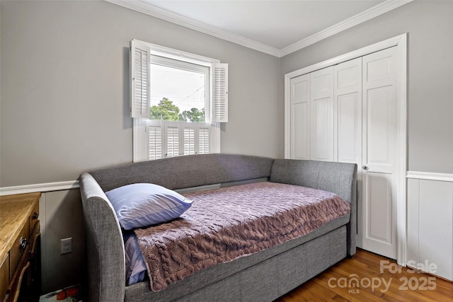 233 Church St, Ellenboro, NC 28040 - bedroom featuring crown molding, wood finished floors, and a closet
