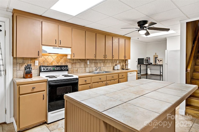 233 Church St, Ellenboro, NC 28040 - kitchen with white appliances, under cabinet range hood, tile countertops, backsplash, and a paneled ceiling