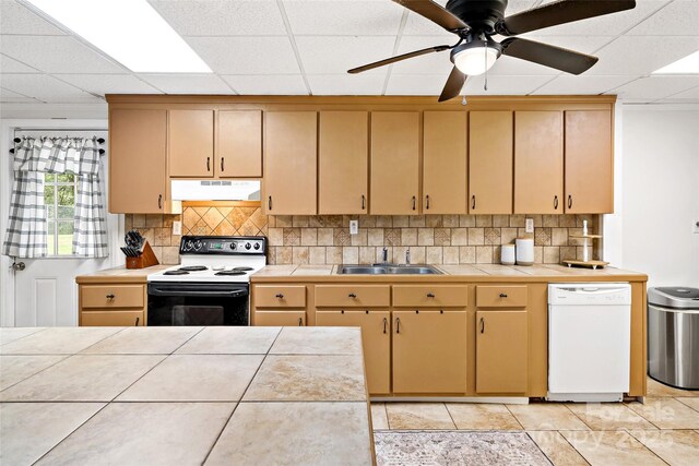 233 Church St, Ellenboro, NC 28040 - kitchen with electric range oven, under cabinet range hood, dishwasher, tile countertops, and a paneled ceiling