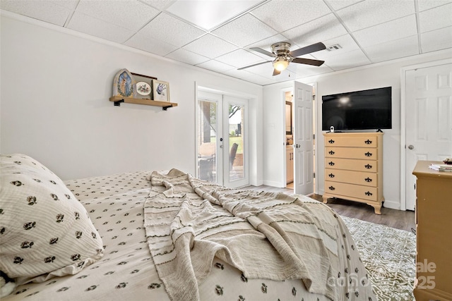 233 Church St, Ellenboro, NC 28040 - bedroom with access to outside, a paneled ceiling, wood finished floors, and a ceiling fan