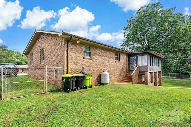 233 Church St, Ellenboro, NC 28040 - back of house featuring brick siding, a sunroom, a gate, and stairs