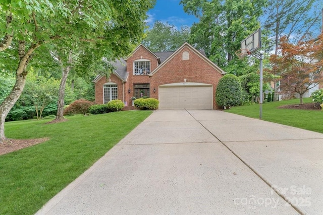 9040 Scottsboro Dr, Huntersville, NC 28078 - traditional-style house featuring brick siding, a front yard, driveway, and a garage