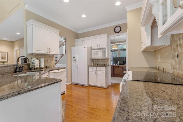 9040 Scottsboro Dr, Huntersville, NC 28078 - kitchen with white appliances, backsplash, white cabinetry, stone counters, and light wood-style floors