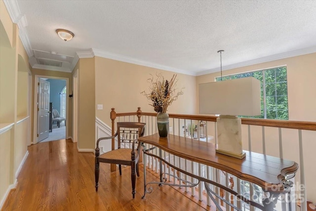 9040 Scottsboro Dr, Huntersville, NC 28078 - hall with wood finished floors, a textured ceiling, an upstairs landing, and crown molding