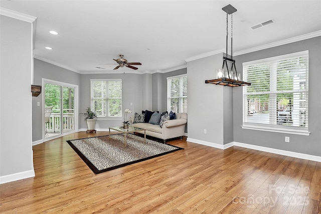 921 NE Dr, Davidson, NC 28036 - living area featuring hardwood / wood-style flooring, ornamental molding, ceiling fan, and recessed lighting